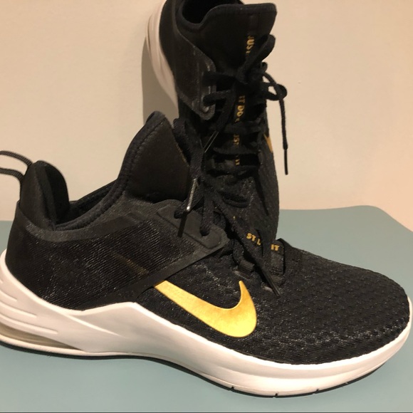 Nike Shoes - Black Nike shoes with gold swoosh Women’s 9.5